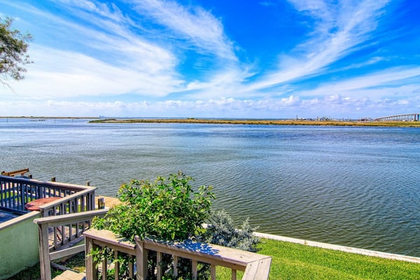 Waterfront condo with deck, bay views & pool - near beaches & dining
