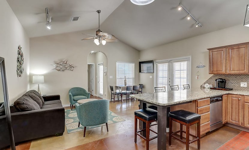 Colorful North Padre townhome with pool, covered patio, AC, & washer/dryer