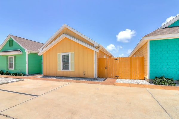 Colorful North Padre townhome with pool, covered patio, AC, & washer/dryer