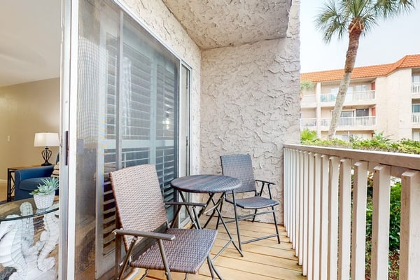 First-floor condo near Whitecap Beach with balcony, pool & dock