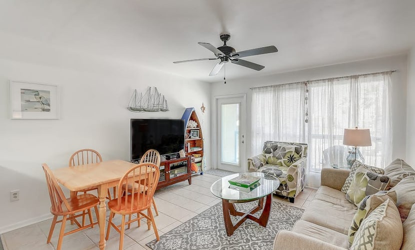 Breezy condo with balcony, pool, fast WiFi, central AC & W/D