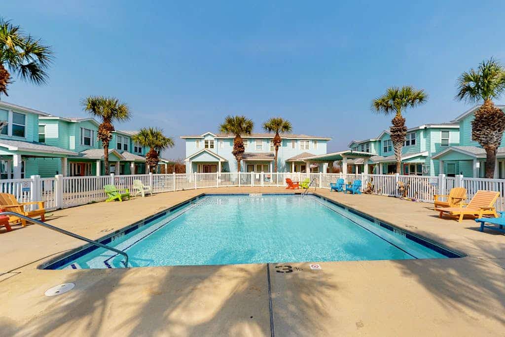 2-story home near the beach with outdoor pool, patio, washer/dryer, AC, & WiFi
