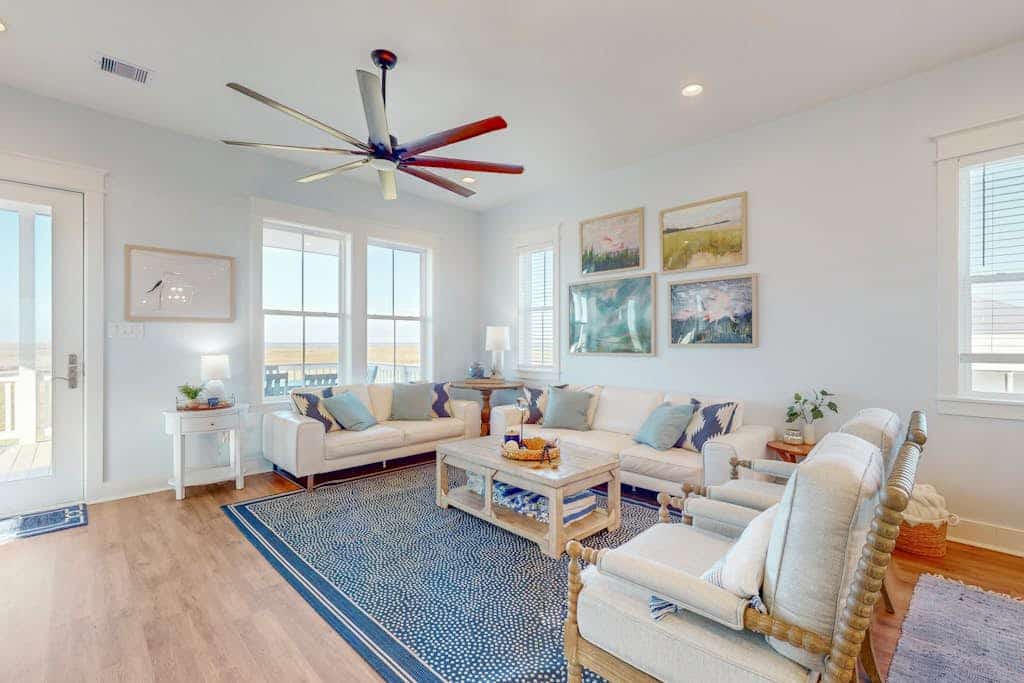 Brand new coastal gem with bay/wetland views, two balconies, & outdoor shower