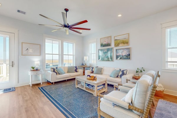 Brand new coastal gem with bay/wetland views, two balconies, & outdoor shower