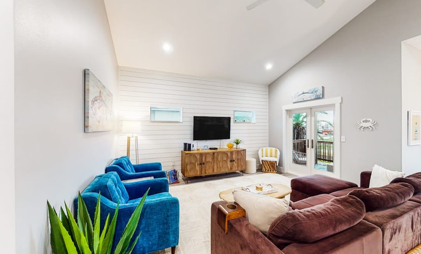 Comforting Port Aransas home with full kitchen, heated pool, patio, & balcony