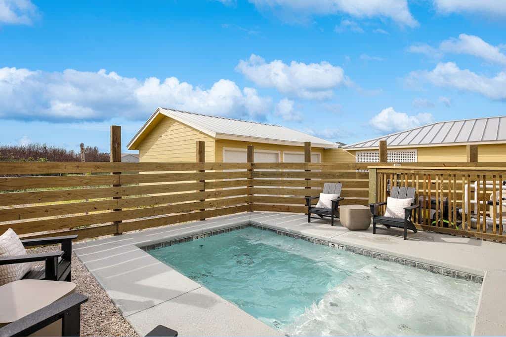 Comforting Port Aransas home with full kitchen, heated pool, patio, & balcony