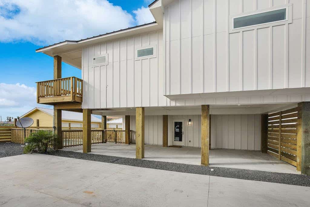 Comforting Port Aransas home with full kitchen, heated pool, patio, & balcony