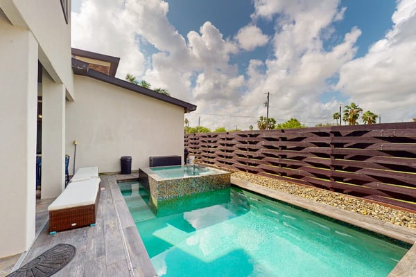 Stunning waterfront home with private pool, gym, & grill - steps to sand & SPI