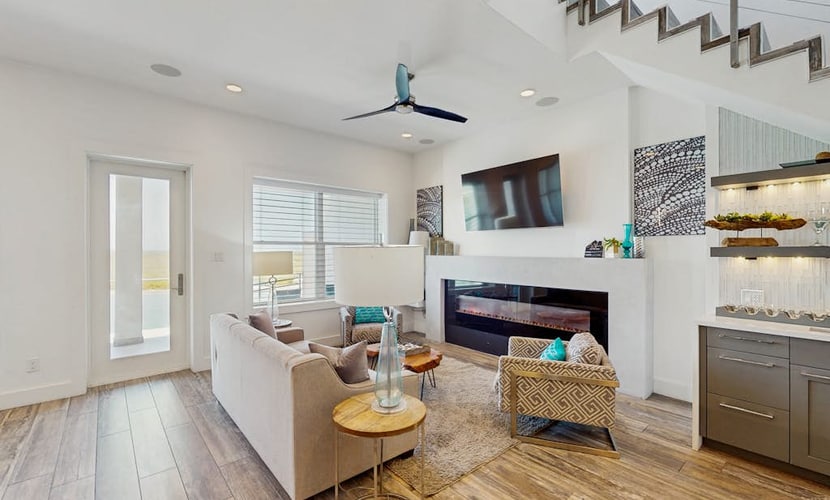 Waterfront townhome with dock, canal view & fireplaces - walk to beach
