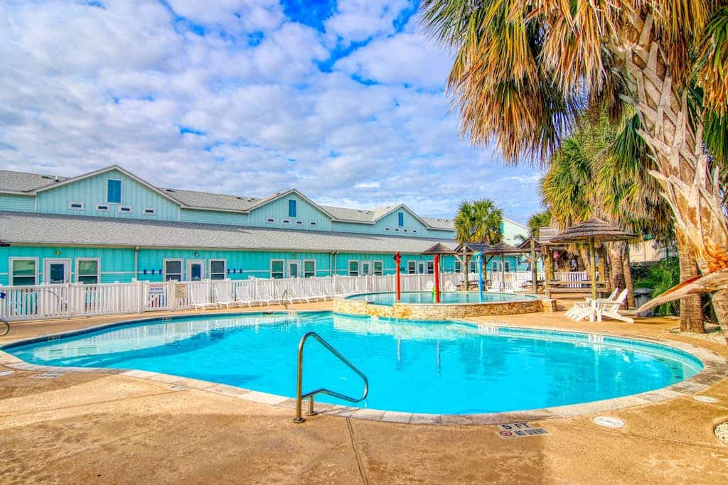 Dog-friendly townhome with pool, & patio - close to beach