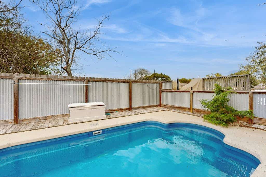 Dog-friendly retreat with a private pool, fenced yard, & AC - close to fishing