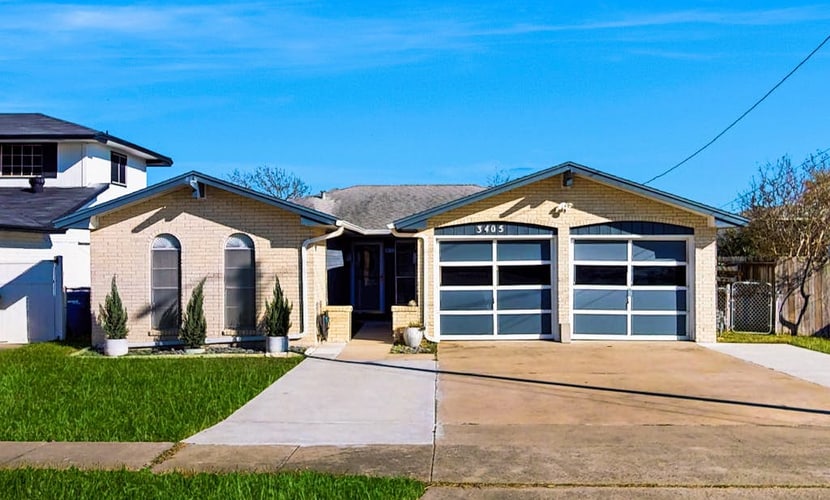 Stunning waterfront home on the canal with large yard & covered patio