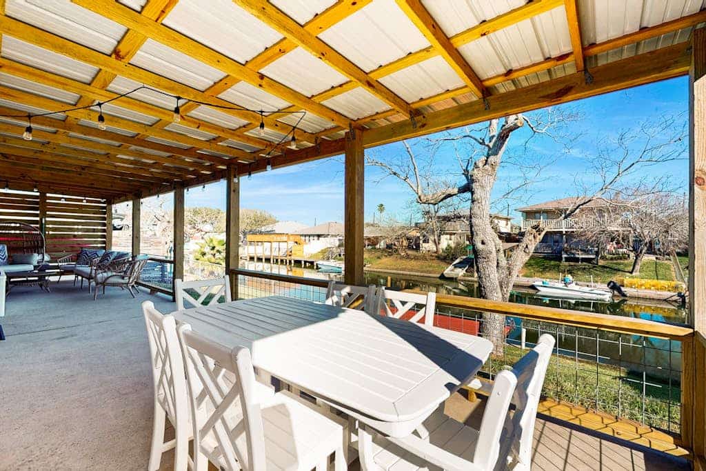 Stunning waterfront home on the canal with large yard & covered patio