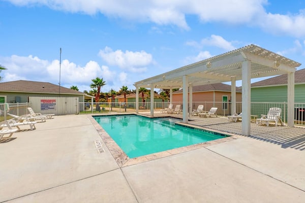 Inviting coastal home with shared pool and stocked pond