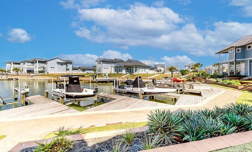Bright waterfront villa with pool, boat slip, patio & balcony in gated community