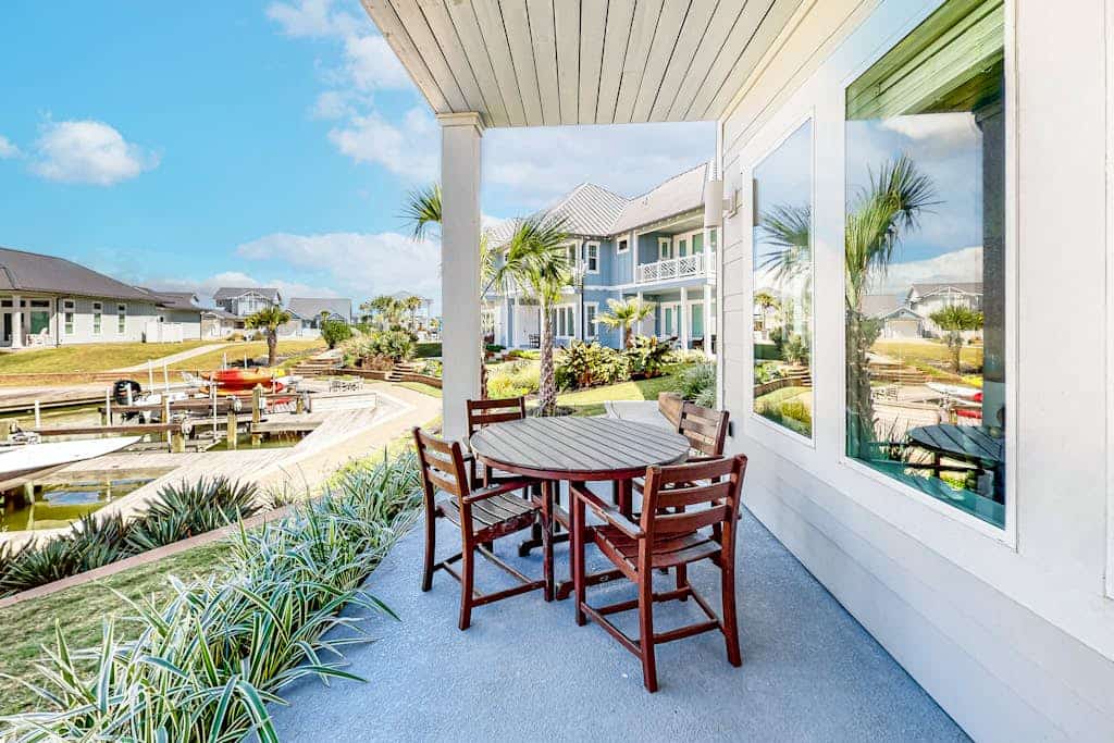 Bright waterfront villa with pool, boat slip, patio & balcony in gated community