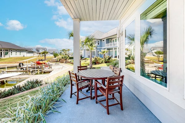 Bright waterfront villa with pool, boat slip, patio & balcony in gated community