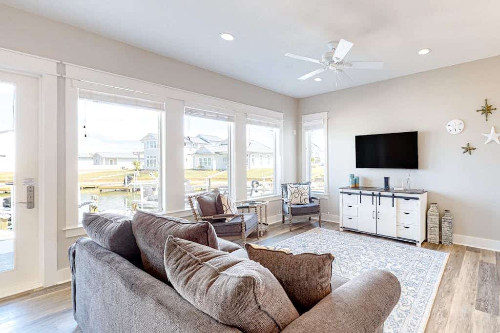 Bright waterfront villa with pool, boat slip, patio & balcony in gated community