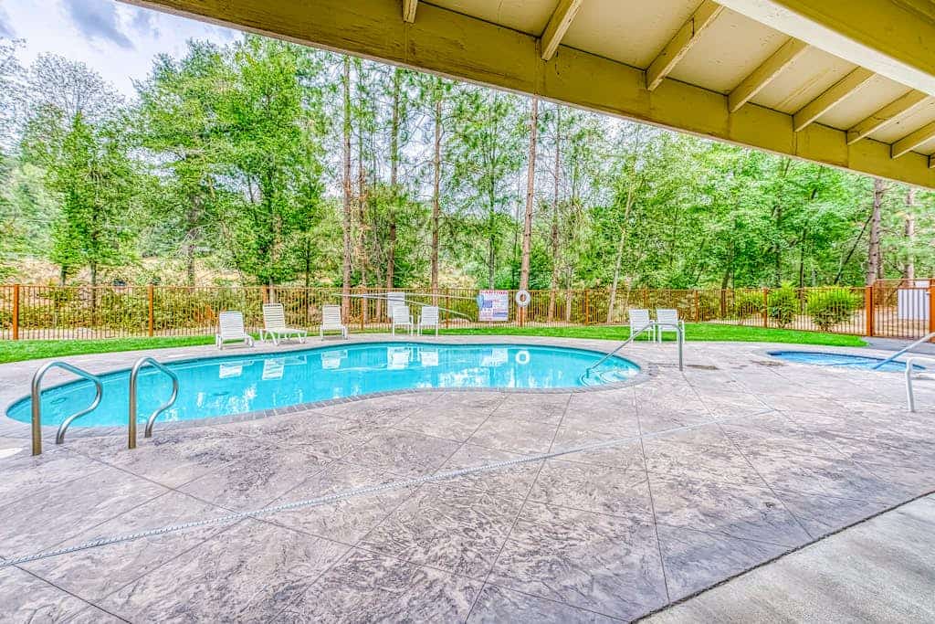Two-story condo in gated community with patio, pool, hot tub - walk to Bass Lake