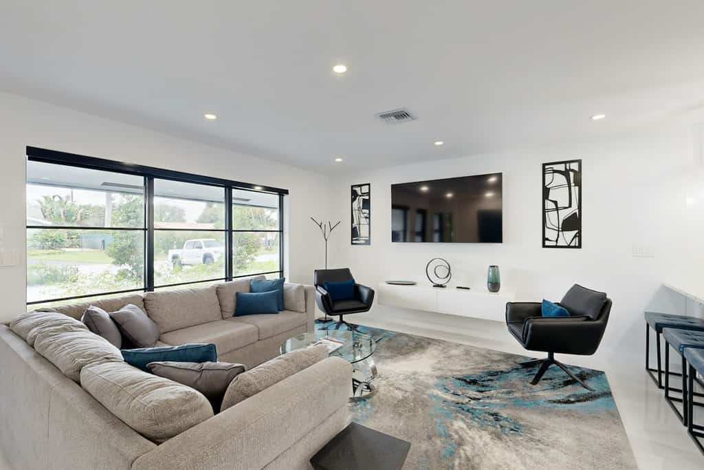 Stunning single level home with, heated pool, kitchen, & fully equipped BBQ area