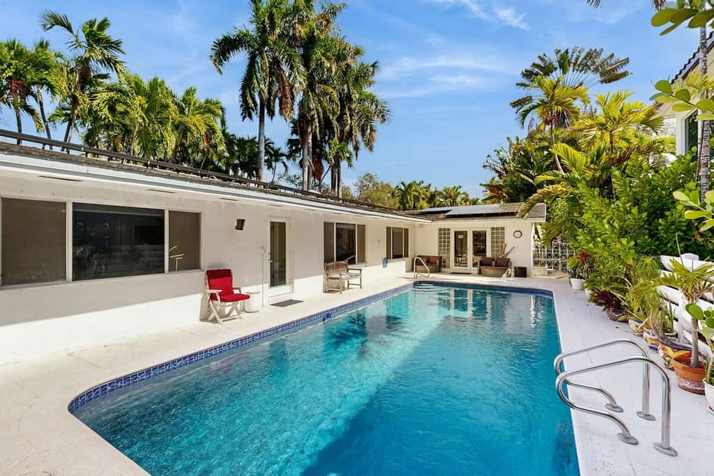 Inviting waterfront home with pool, enclosed yard, firepit, W/D, & dog-friendly