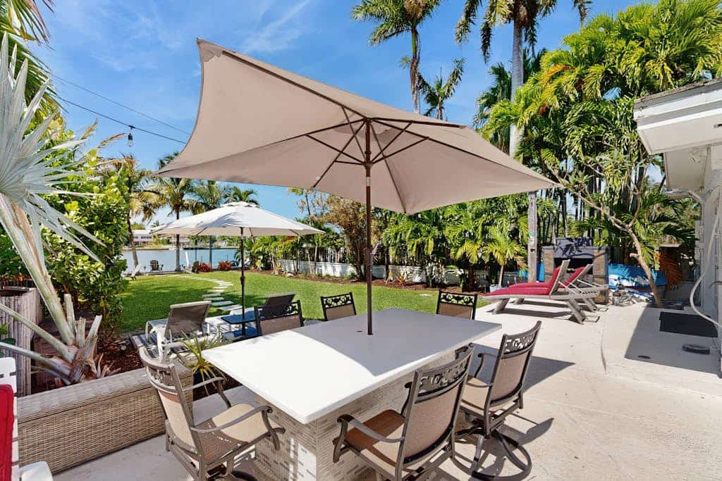 Inviting waterfront home with pool, enclosed yard, firepit, W/D, & dog-friendly