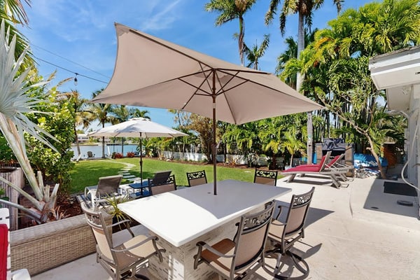 Inviting waterfront home with pool, enclosed yard, firepit, W/D, & dog-friendly