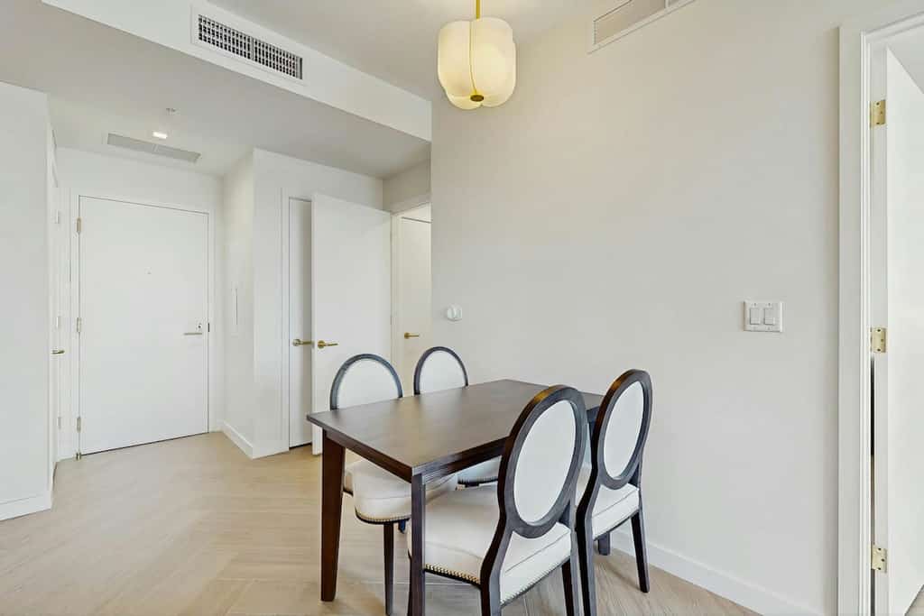 Modern condo with skyline views, rooftop pool & private balcony