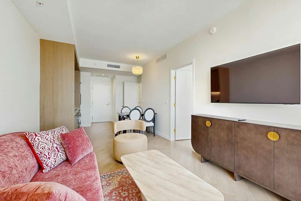 Modern condo with skyline views, rooftop pool & private balcony