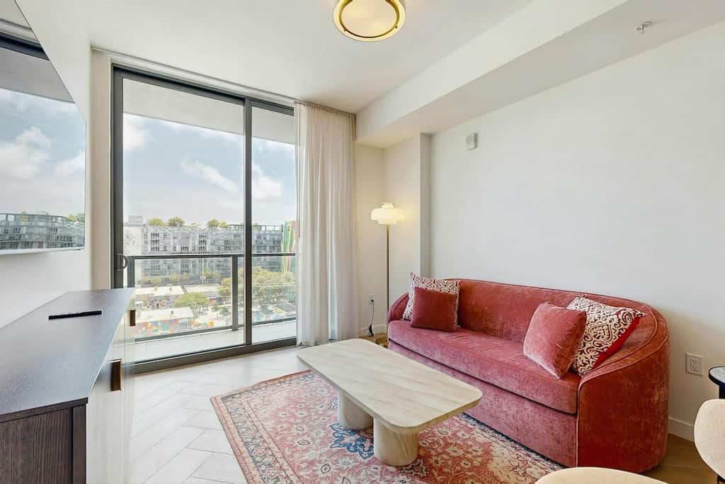 Modern condo with skyline views, rooftop pool & private balcony