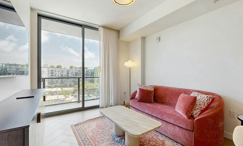 Modern condo with skyline views, rooftop pool & private balcony