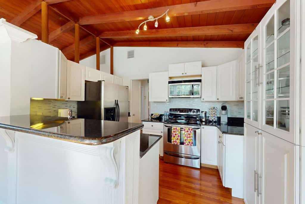 Single-level home with private yard, screened patio, AC, & W/D