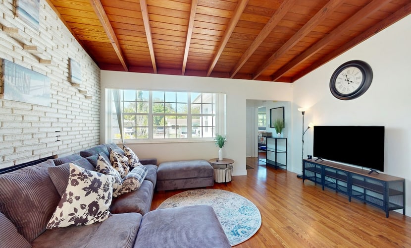 Single-level home with private yard, screened patio, AC, & W/D