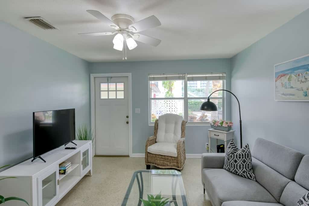Modern condo near towering palms with beach decor, grill, & yard - walk to beach