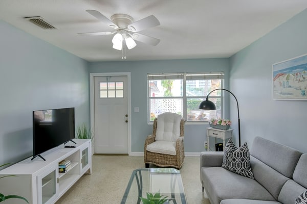 Modern condo near towering palms with beach decor, grill, & yard - walk to beach