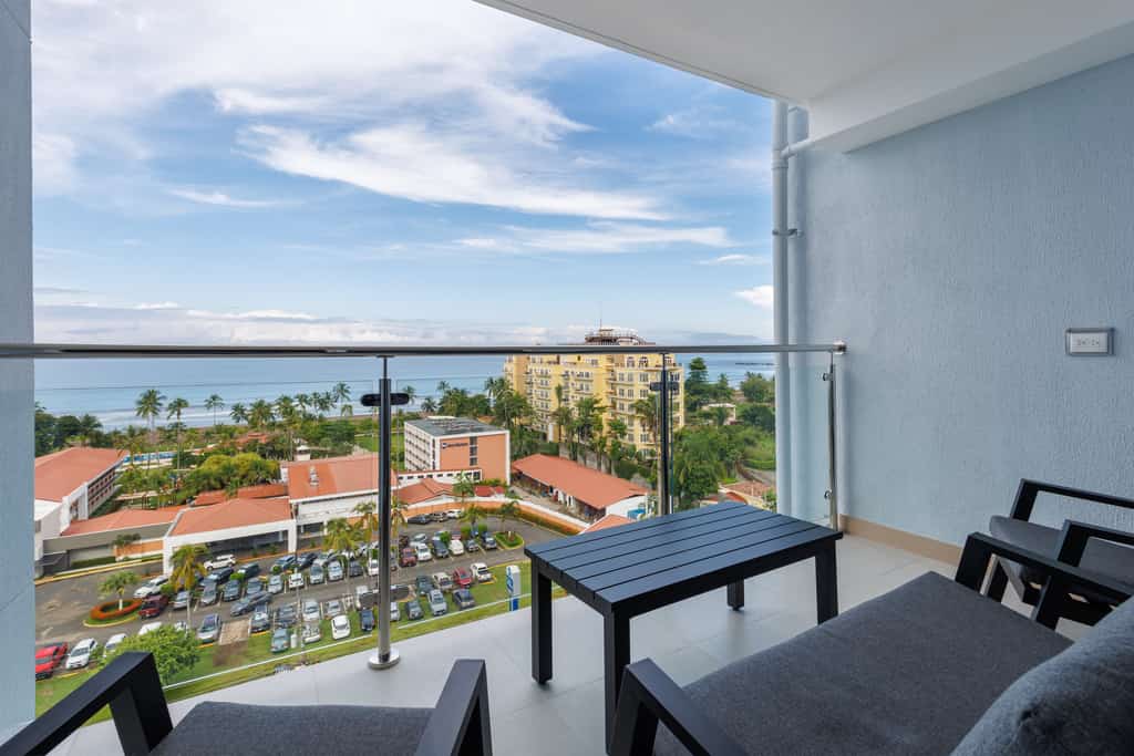 Welcome to our vibrant ocean view condo-high floor, perfect for family getaways! Nestled just a short stroll from the heart of Jaco, this modern oasis boasts stunning ocean views and a playful, colorful decor that creates a joyful and relaxing atmosphere. Ideal for families with children, our condo features two spacious bedrooms designed with comfort and fun in mind. The open-plan living area is bright and inviting, offering plenty of space for quality time together. Enjoy the convenience of being steps away from the beach, where you can build sandcastles or take a refreshing dip in the sea. With its prime location near Jaco's central attractions, you'll have easy access to local dining, shopping, and entertainment. Experience the perfect blend of modern style and coastal charm in our delightful condo. We look forward to hosting you and ensuring your stay is memorable and enjoyable!
