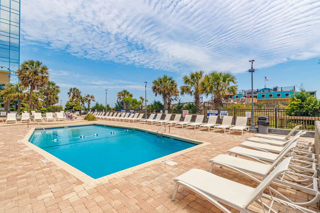 Discover your perfect beach vacation at this tenth floor oceanfront apartment in Myrtle Beach. Designed for comfort and convenience, our property features a well appointed kitchen and a bright, welcoming living space overlooking the Atlantic Ocean. Step outside to enjoy resort style perks like indoor and outdoor pools, or take a short walk to explore the vibrant downtown area, local golf courses, and popular family attractions. From horseback riding and cycling to relaxing by the water, this central location is ideal for travelers seeking a mix of adventure and tranquility in a premier beachfront setting.