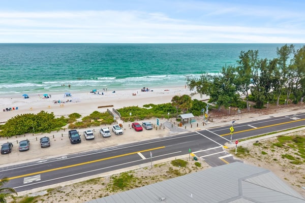 Welcome to The Pearl, a luxurious oceanfront Anna Maria Island vacation home where white-sand beaches and historic charm are just steps from your front door.
This 6-bedroom home is divided into two apartments with 3-bedrooms and 2.5 baths each, giving your large group plenty of space and privacy. Each floor offers unique and cozy coastal decor, an open-floor plan living room, secondary bedrooms sharing a Jack-and-Jill bath, and a primary suite with a king-sized bed, private oceanview balcony, and spa bath with garden tub. Unit B is on the 3rd floor, with both elevator and stair access.
The expansive backyard offers plenty of shaded space for dining and relaxing, along with an outdoor television, heated pool, and putting green.
Prepare and enjoy family meals in the stocked, ocean-view kitchen and informal dining room, or take advantage of shaded outdoor dining on the patio. Not in the mood to cook? Local favorites are just three blocks away at Historic Bridge Street, the epicenter of South AMI dining and nightlife.
When its time for the beach, you'll have everything you need, including towels, chairs, and umbrellas.
Key Features & Highlights:
Prime Location: This Anna Maria Island vacation home is located directly across the street from Cortez Beach, putting you just steps away from the ocean. Historic Bridge Street's dining, shopping and nightlife are just three blocks away.
Light & Airy Living: Open-concept living space designed for gathering with family or friends offers ocean views from the kitchen, dining nook, living room, and primary bedroom.
Beach Ready: Beach gear included so you can sink your toes into the sand from day one!
Book now and see why this expansive oceanview vacation home is truly The Pearl of Anna Maria Island.
