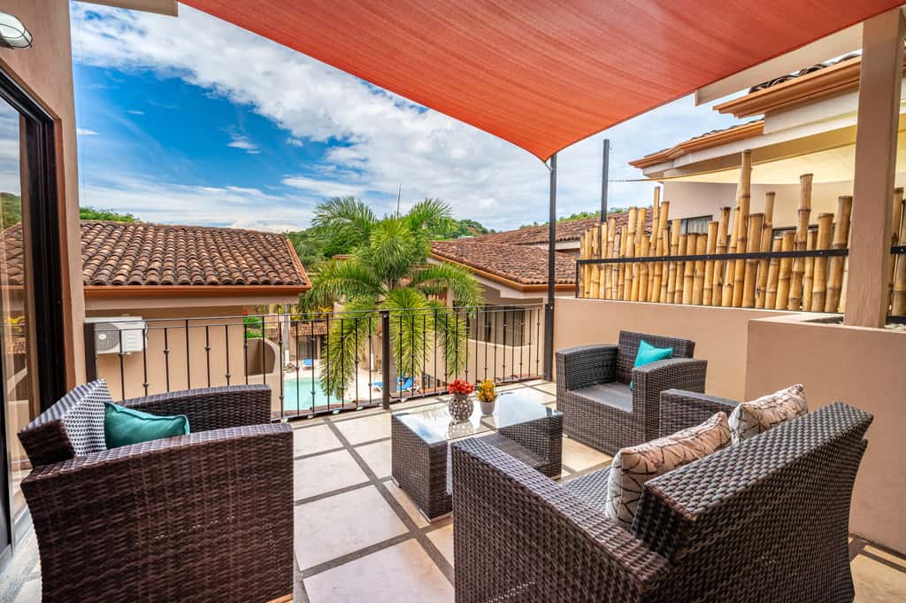 Sunny 2BR: Balcony, Pool, Kitchen, Walk to Beach