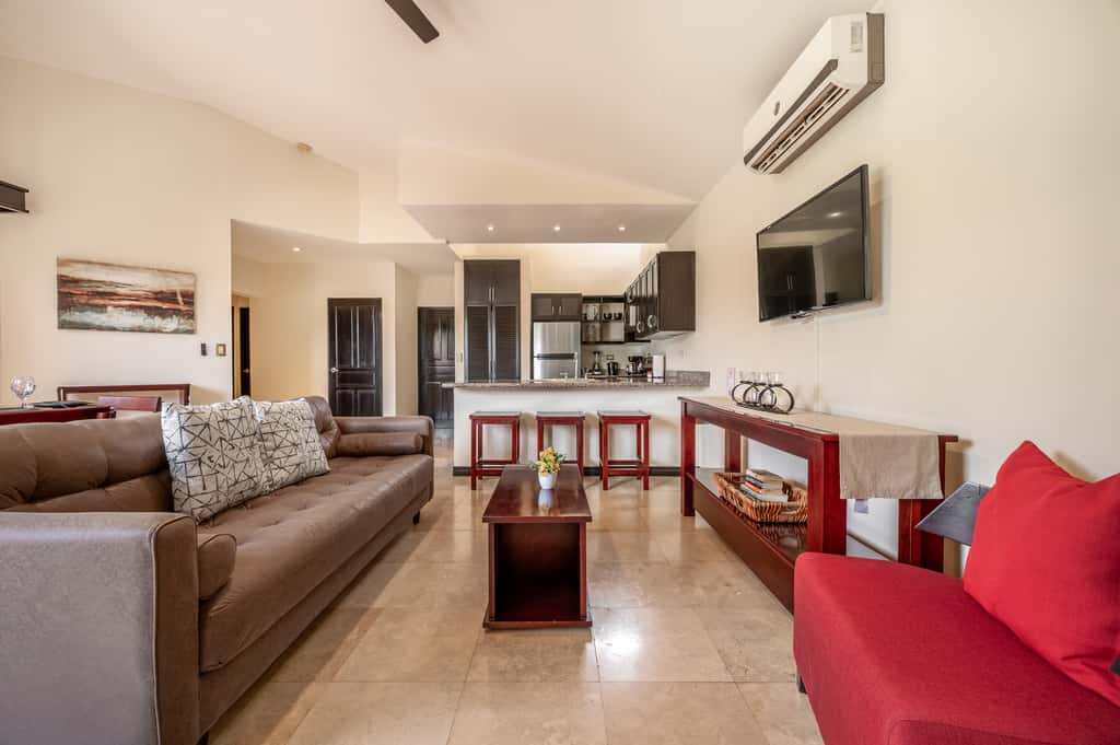 Sunny 2BR: Balcony, Pool, Kitchen, Walk to Beach