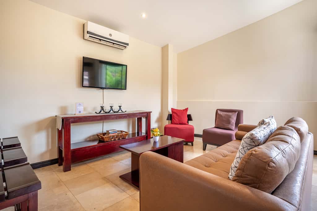 Sunny 2BR: Balcony, Pool, Kitchen, Walk to Beach