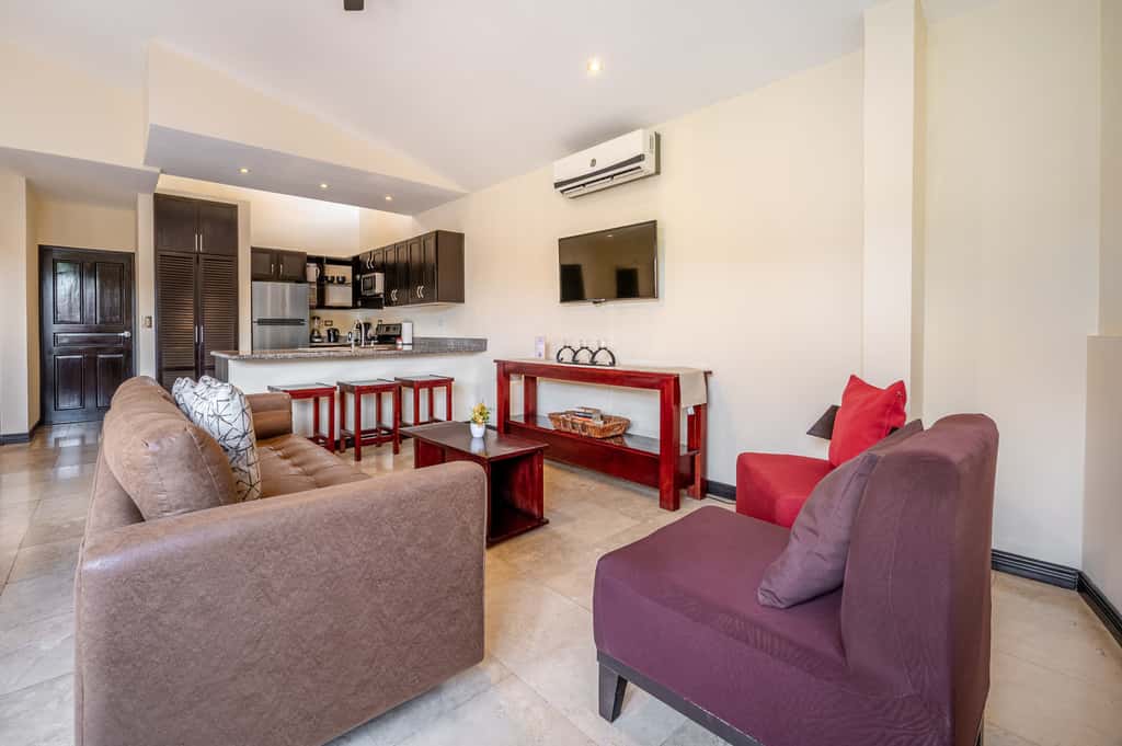 Sunny 2BR: Balcony, Pool, Kitchen, Walk to Beach