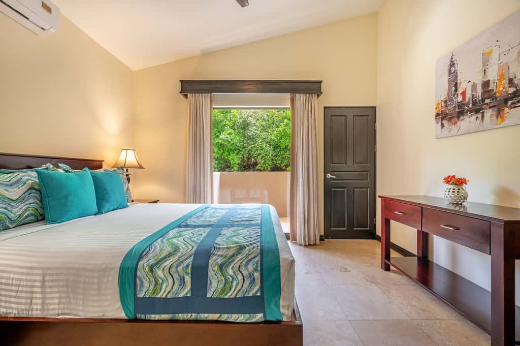 Sunny 2BR: Balcony, Pool, Kitchen, Walk to Beach