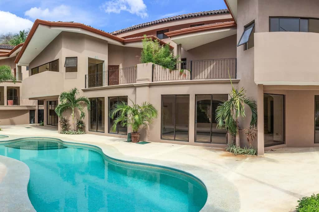 Sunny 2BR: Balcony, Pool, Kitchen, Walk to Beach