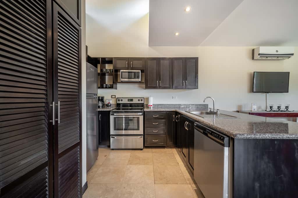 Sunny 2BR: Balcony, Pool, Kitchen, Walk to Beach