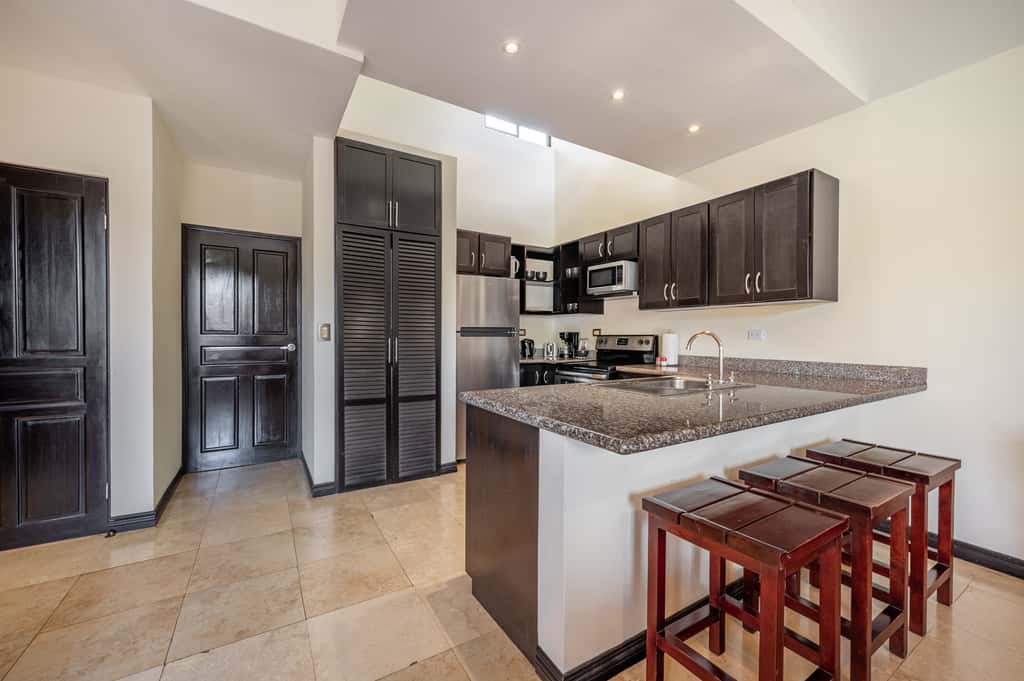 Sunny 2BR: Balcony, Pool, Kitchen, Walk to Beach