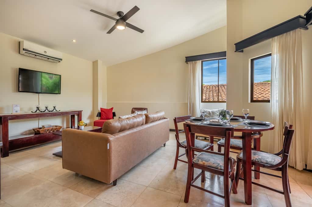 Sunny 2BR: Balcony, Pool, Kitchen, Walk to Beach