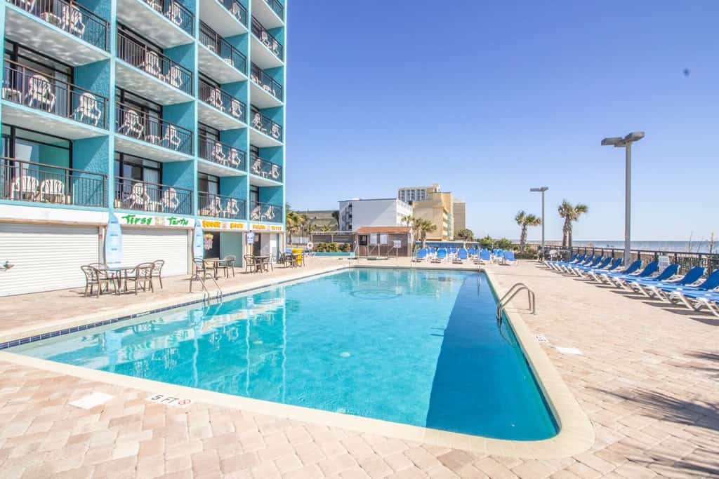 Welcome to your oceanfront getaway at the Landmark Resort in Myrtle Beach! Located on the sixth floor, this beautifully updated one-bedroom suite offers direct oceanfront views, a private balcony, and a unique open-concept layout that makes the space feel comfortable and spacious. With two queen beds in the bedroom and a full-size Murphy bed in the living area, this condo can comfortably accommodate up to six guests.