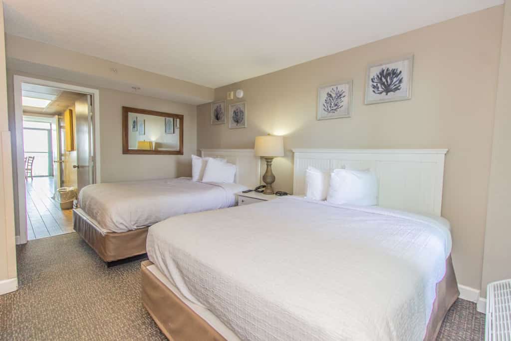 Welcome to your oceanfront getaway at the Landmark Resort in Myrtle Beach! Located on the sixth floor, this beautifully updated one-bedroom suite offers direct oceanfront views, a private balcony, and a unique open-concept layout that makes the space feel comfortable and spacious. With two queen beds in the bedroom and a full-size Murphy bed in the living area, this condo can comfortably accommodate up to six guests.