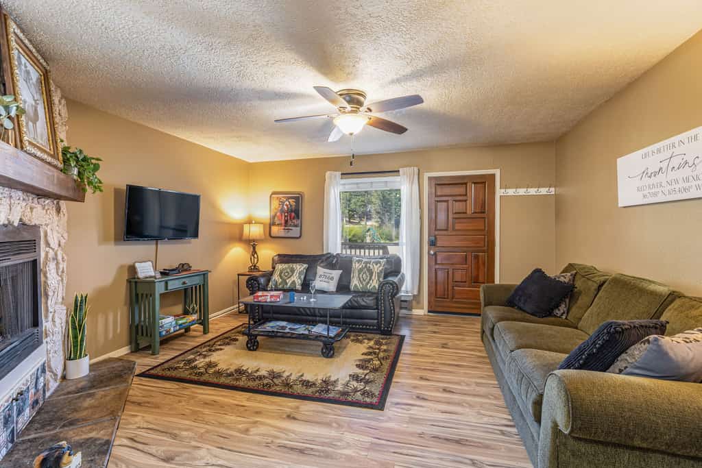 Welcome to Tenderfoot Retreat, a two-story condo tucked along Pioneer Creek about a mile from downtown Red River and the ski area. Two private suites each offer their own bath and balcony, and a sleeper sofa brings the group to six. Cook in the full kitchen, gather by the gas fireplace for game night, and soak in the community spas after a day of skiing, hiking, or festivals. With forest and mountain views from two balconies, it is an easy, comfortable mountain basecamp in every season.
